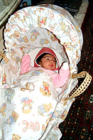 Layla in her Moses basket